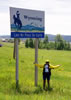 Kathy with the Wyoming state sign
